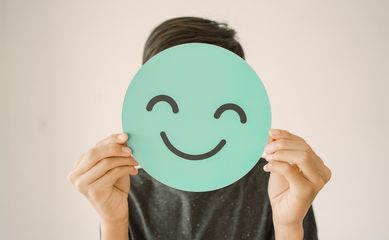 Happy,Mixed,Asian,Teen,Boy,Holding,Smile,Emoji,Face,,Positive